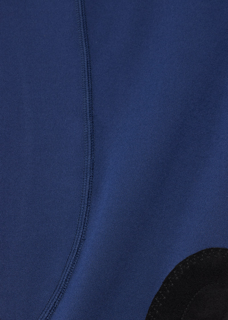 Close-up of the fabric texture, emphasizing the soft, sueded material and the four-way stretch for comfort