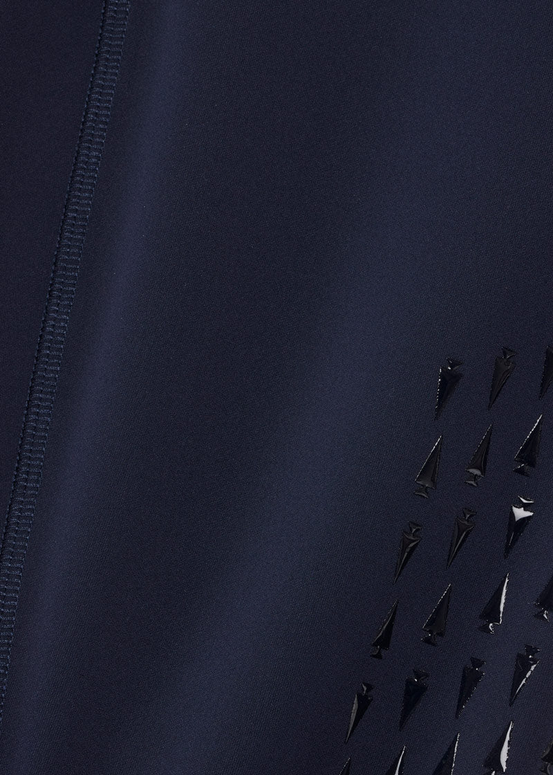 Close-up of the Coolcore® Stretch Interlock fabric, emphasizing its chemical-free fibers engineered to manage and quickly distribute moisture and body heat through thermo-controlled evaporation