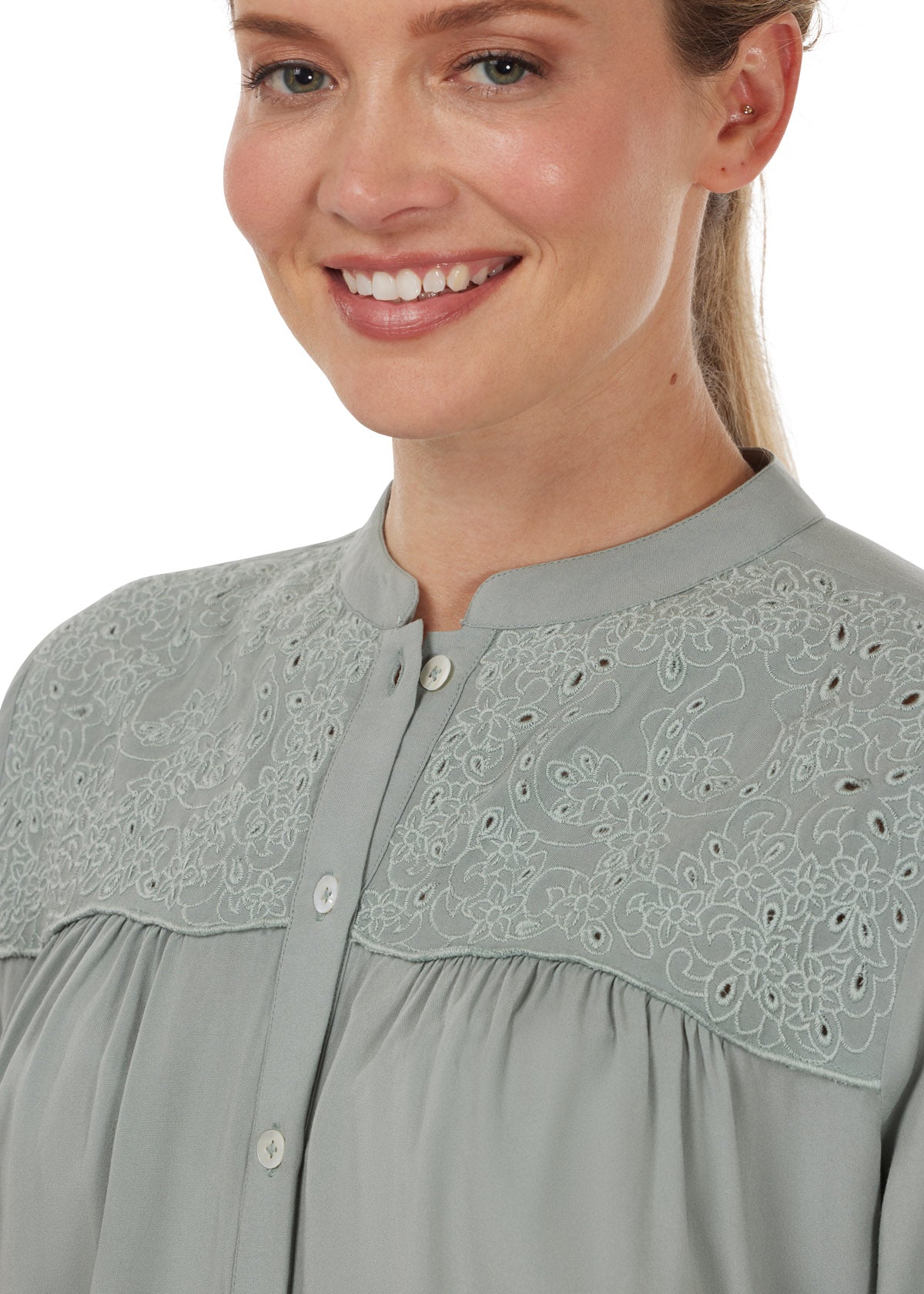 Detailed view of the floral horseshoe cutout embroidery on the front yoke, emphasizing the subtle equestrian details.