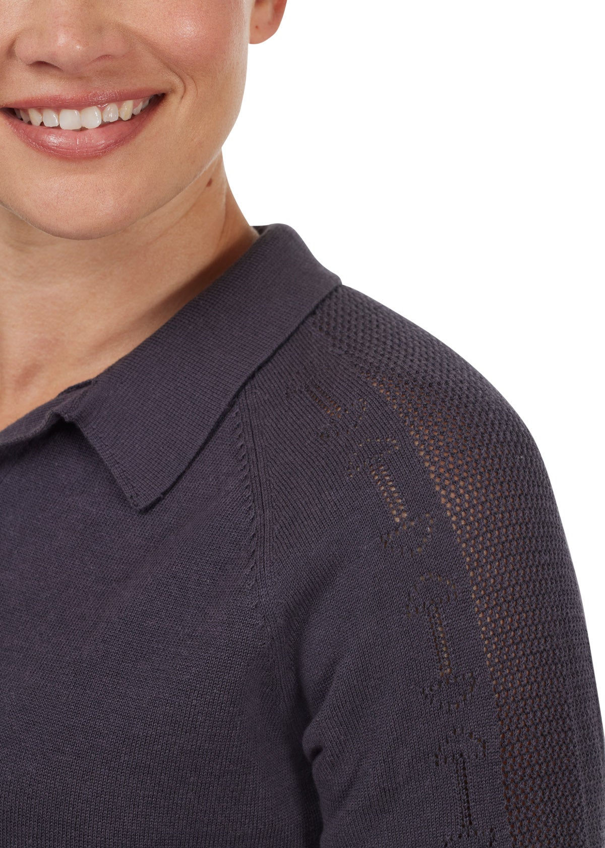 Close-up of the snaffle bit pointelle knit detail on the shoulder and sleeve of the Bit of Breeze Sweater Knit Polo, adding a subtle equestrian touch.