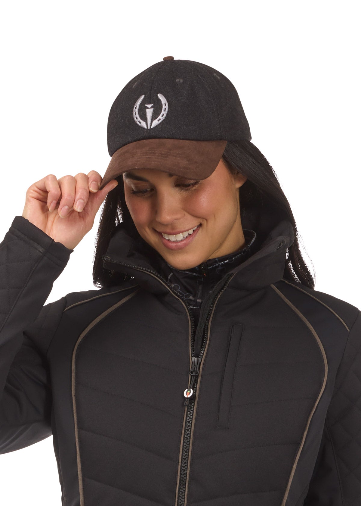Woman wearing black Kerrits winter baseball hat on a white background