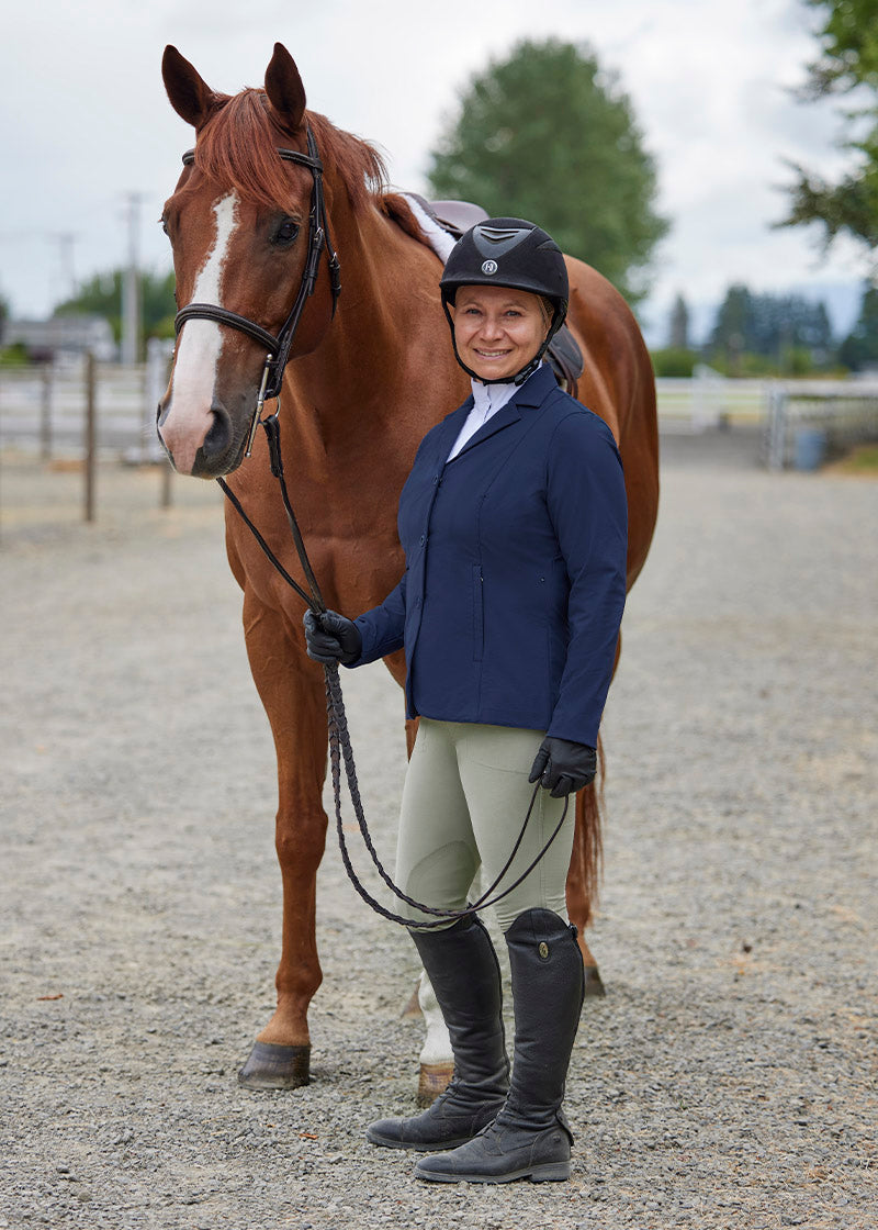 Person wearing the breeches in an outdoor setting, highlighting their classic equestrian style